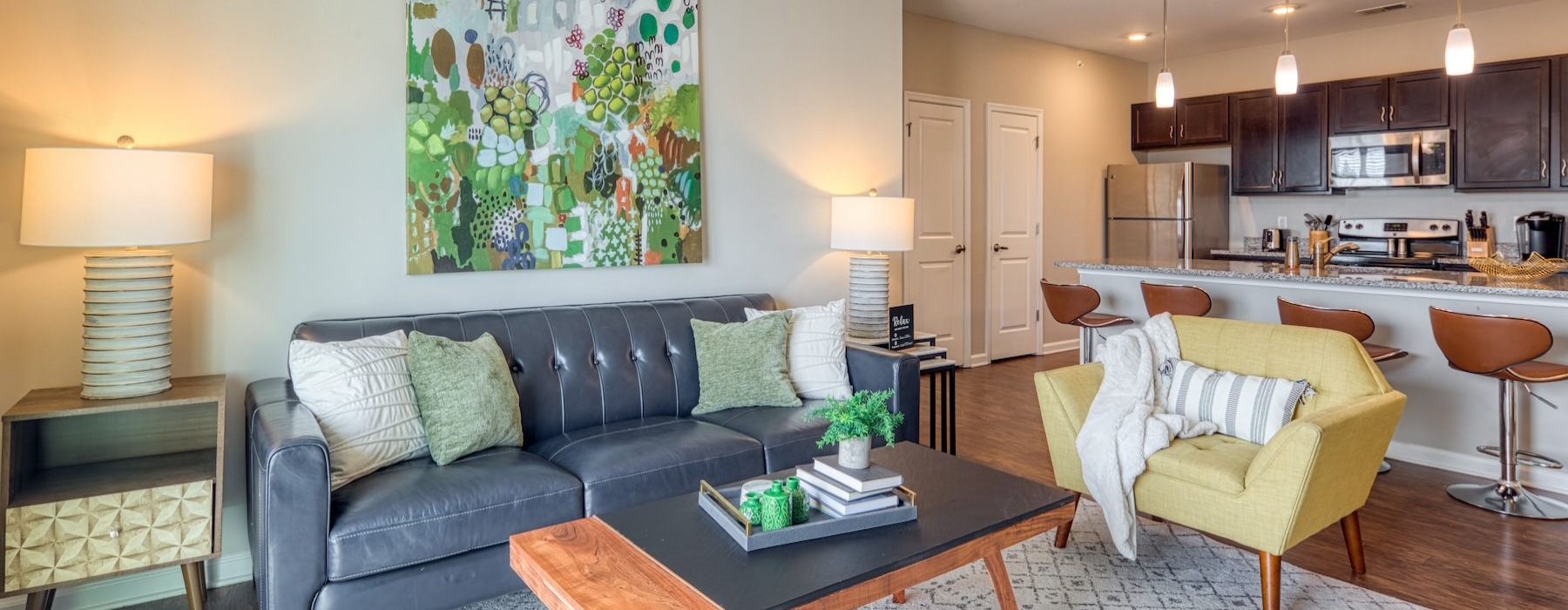 a living room with a couch, chair, and coffee table