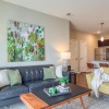 a living room with a couch, chair, and coffee table