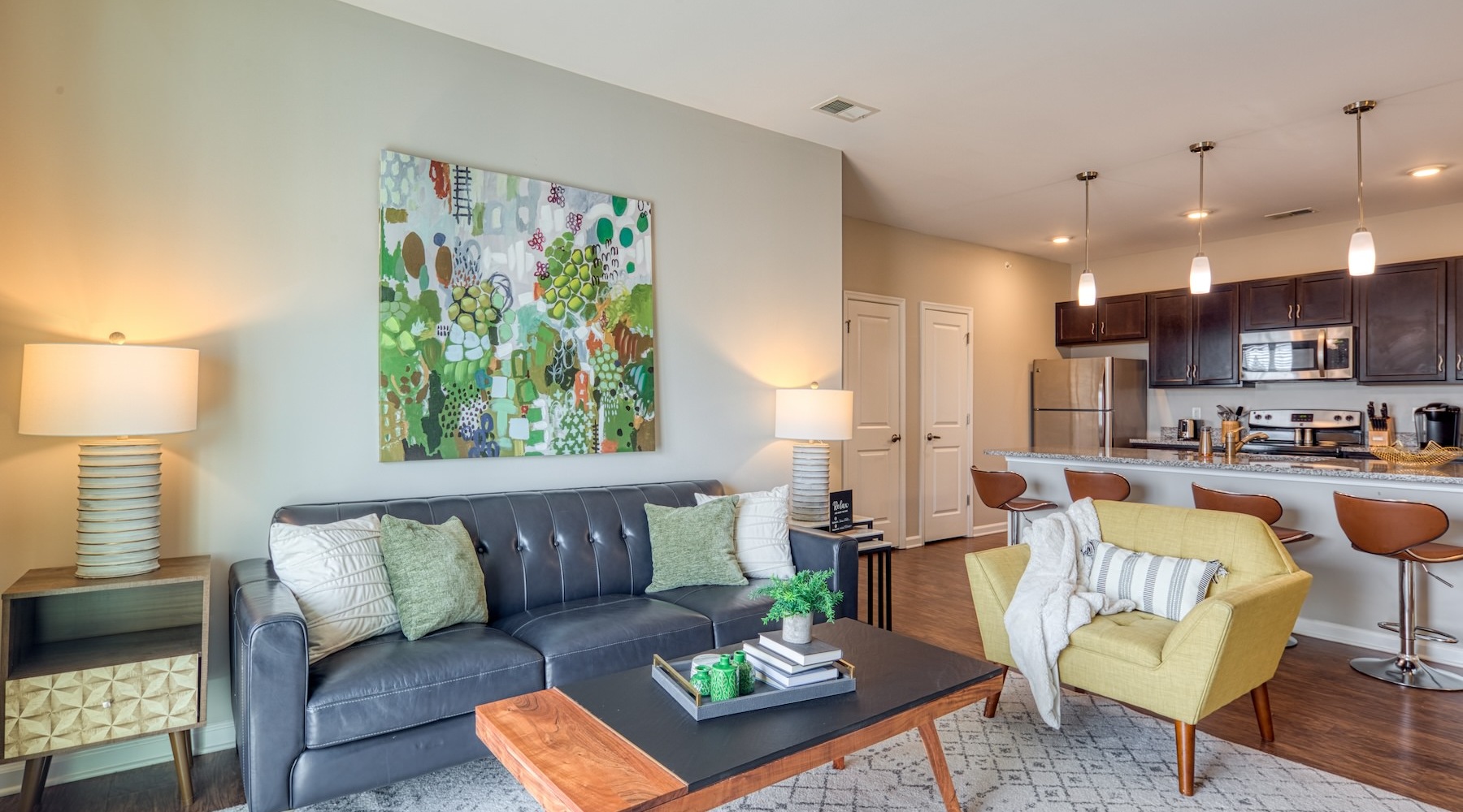 Spacious living areas to relax and unwind a living room with a couch, chair, and coffee table