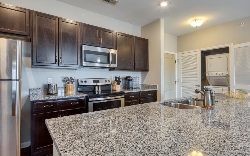 a kitchen with marble counters