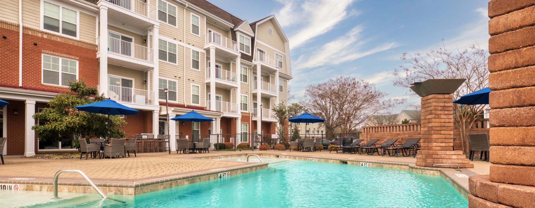 a swimming pool in front of a building