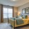 a bedroom with a bed and lamps