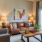 a living room with a couch coffee table and a painting on the wall