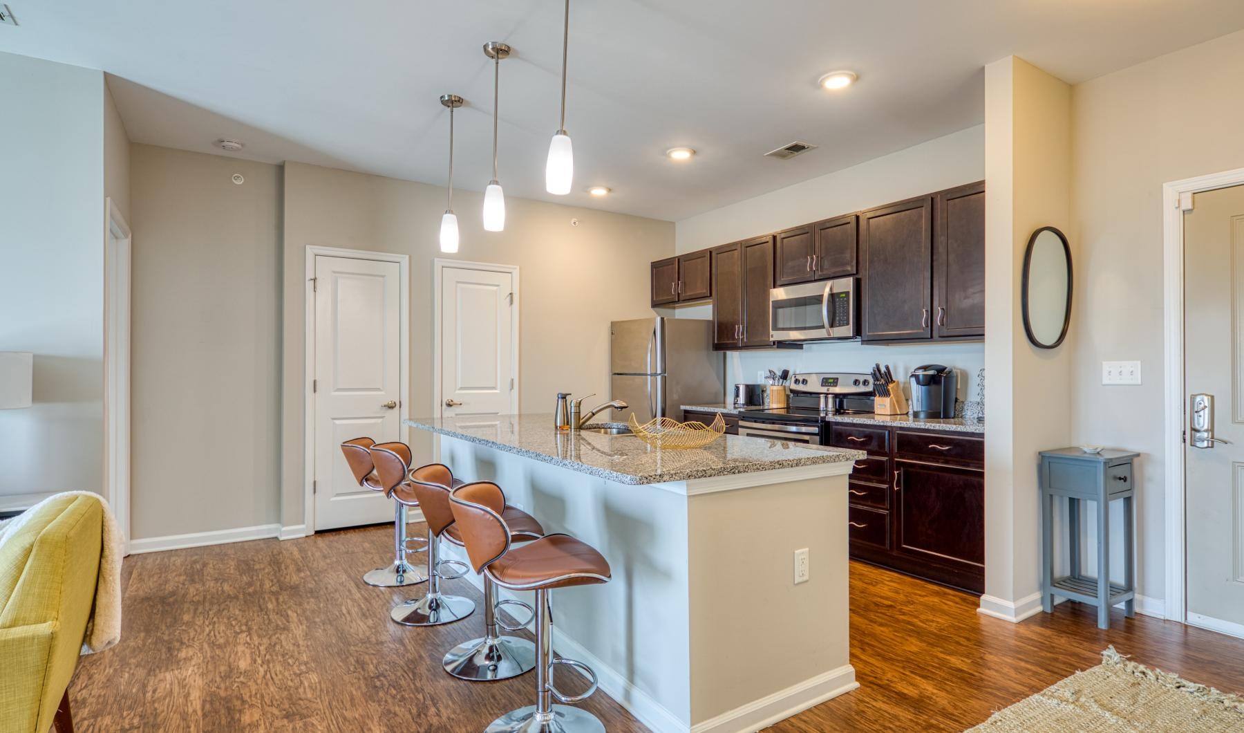 Find your perfect fit at Watermark at Talbot Park a kitchen with a bar stool and a bar stool