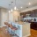 a kitchen with a bar stool and a bar stool